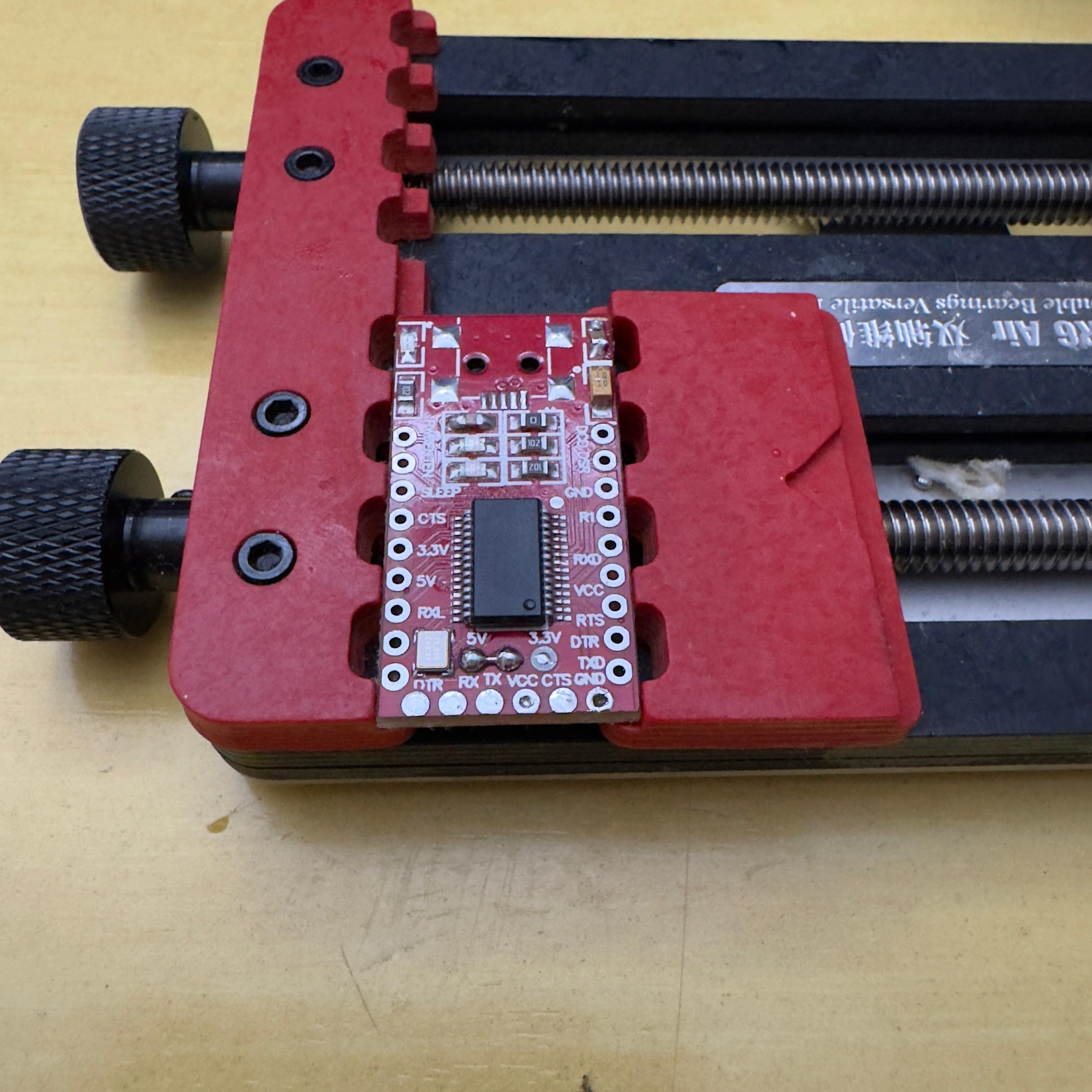 FT232RL clamped on a holder, ready to wire